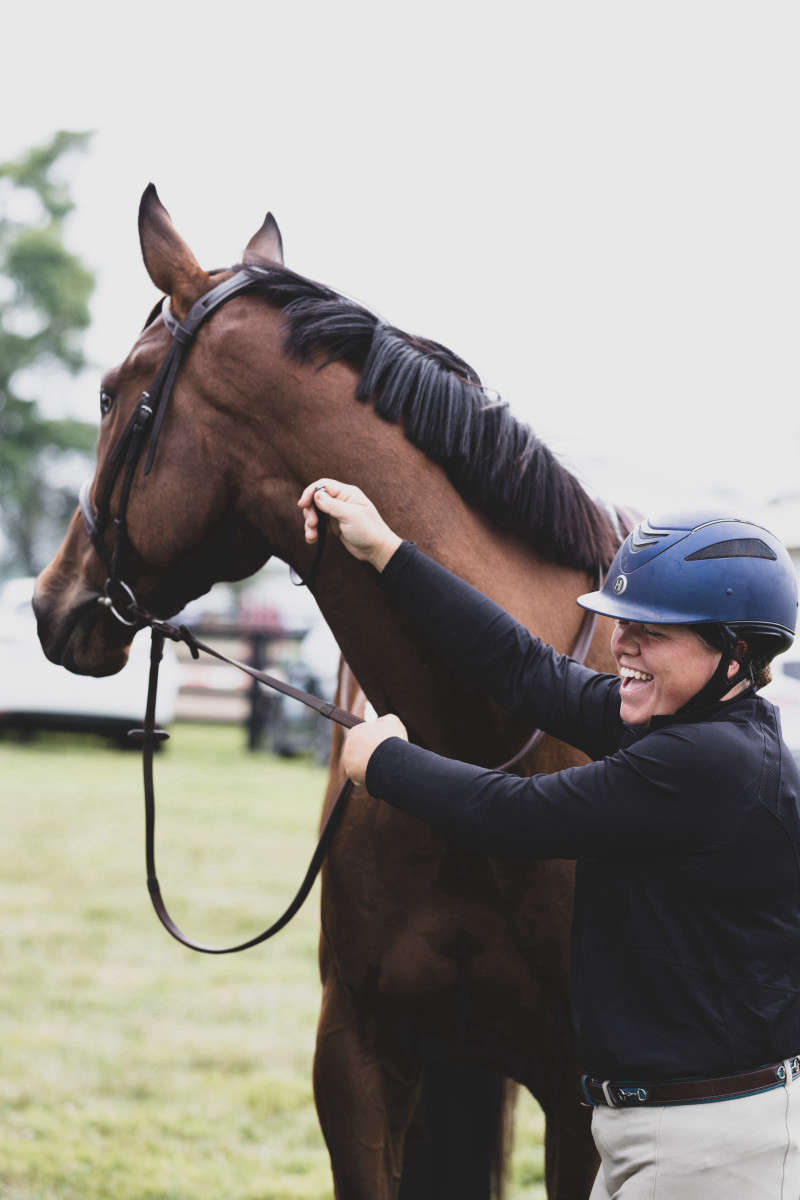 Horse and Rider tacking up candid photograph